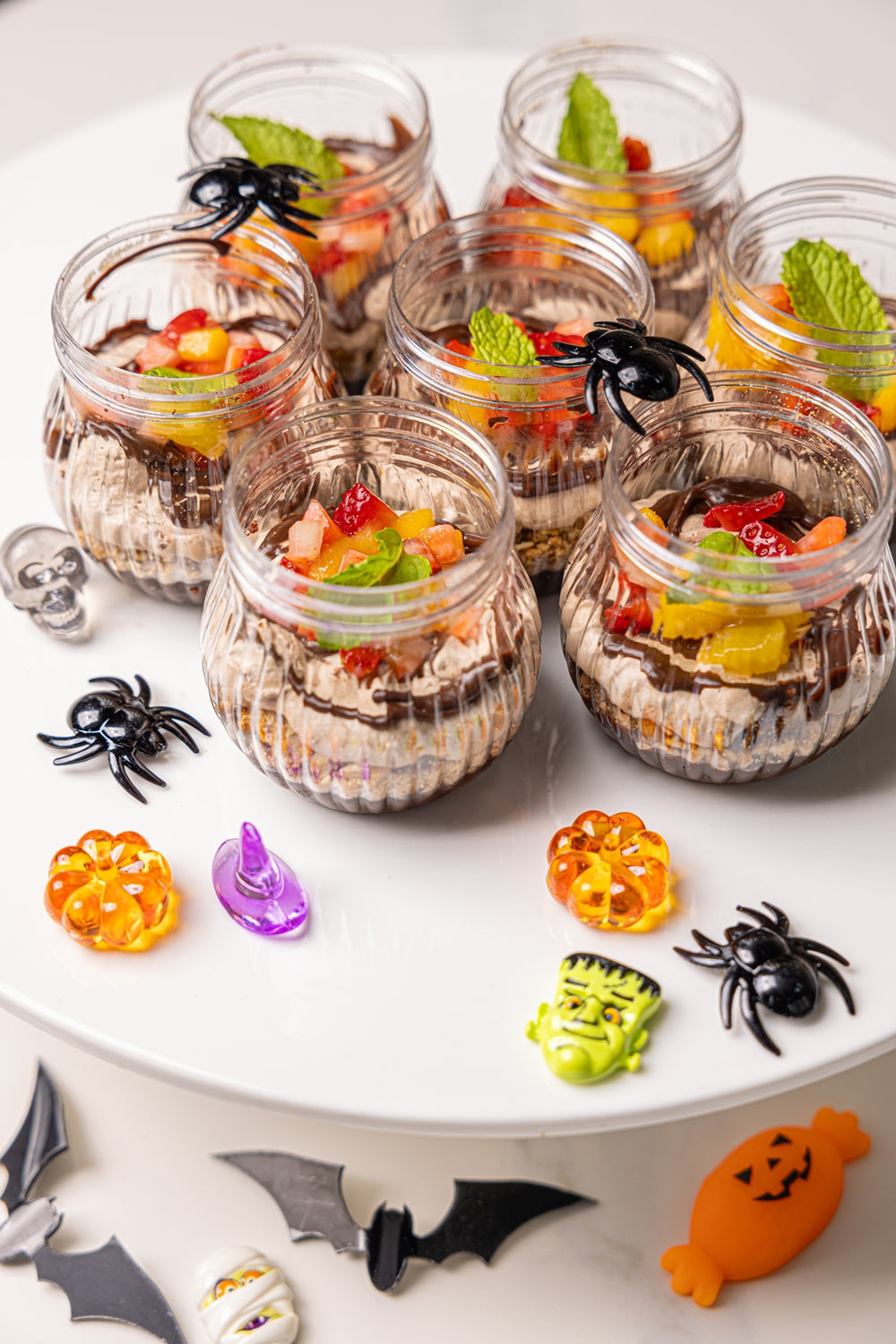 Test decorative glass jars with orange, green, and red candy toppings