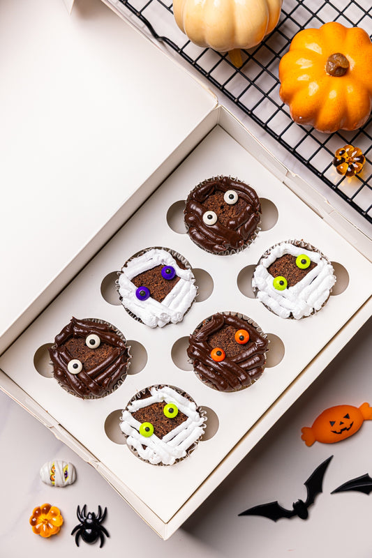Pack of 6 Halloween cupcakes in a gift box, chocolate and white frosted spooky faces